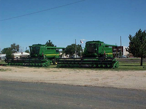 John Deere combines waiting to be used for harvest