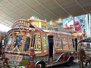 The bus decorations are intricately detailed in a rainbow of colors