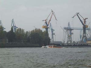 Giant cranes hover over the docks to load cargo onto ocean going ships