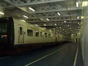 The train car on a level deck aboard the ferry