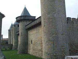The walls are tall and well defended; in the grassy space knights used to hold tournaments