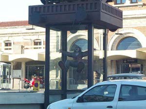 The sculpture of Dali is life size, inside a glass case, and depicts Dali, arms spread, feet up, gesturing excitedly