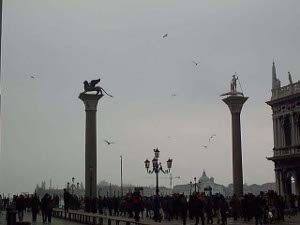 One tall column supports a winged lion, the other a statue of St. Theodore