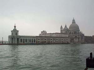 The basilica of Saint Mary of Health forms a beautiful sight across the Grand Canal from the plaza of St Mark.  It has a domed roof