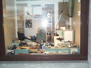 The store window has mostly reels, but some nets and other gear