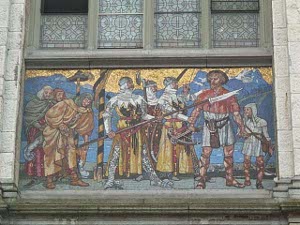 The fresco depicts three knights, one with a halberd held in front of a crossbowman wearing a short tunic.