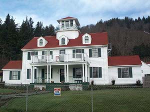 The white, red, and green colors of this Coast Guard building are specified in the ages-old Paint and Color Manual
