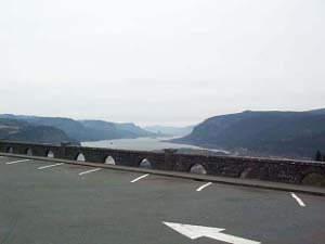 The Columbia River stretches off into the distance, flanked by hills