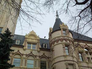The windows are elaborately decorated, and the corners are set off with round towers