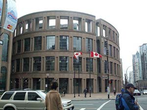 Looking somewhat reminiscent of the Roman Coliseum, the Vancouver public library is circular, with large windows separated by brown structure