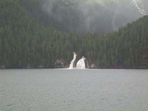 Through the gray day we saw waterfalls cascading to the sea