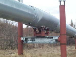 The pipe is free to slide back and forth along the sled to accommodate winter expansion and contraction