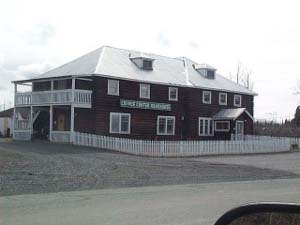 The two story frame building surrounded with a white picket fence was a welcome sight for early Alaska travelers