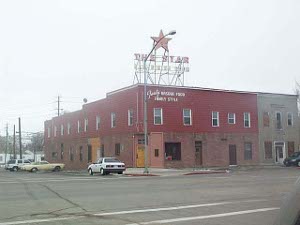 A two story building with rooms upstairs for Basque shepherds, and a bar and dining room below