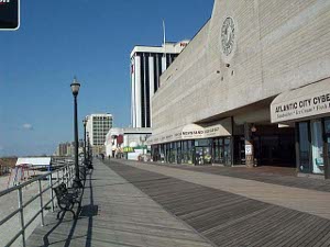 The board walk is wide and wood planked and runs for a long distance up and down the beach in front of the stores and hotels and attractions
