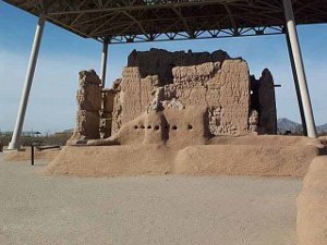 The adobe and stucco building protected by a steel roof