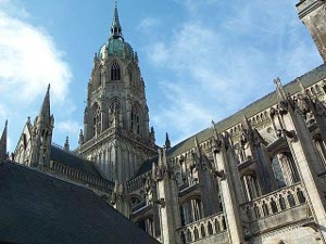 The photo captures the green topped dome on the tower of the Bayeux Cathedral