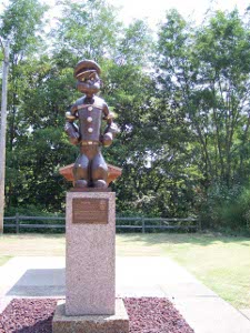 The statue of Popeye is about three feet, on a plinth of the same height