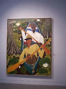 Two men in a pirogue in a bayou