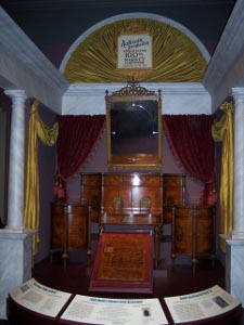 Highly lacquered and rounded display of fine furniture made in Grand Rapids for the Centennial market display