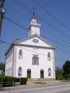 The solid white structure, two stories plus an attic and tower, was built to last, and it has