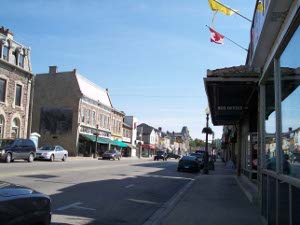 A broad shopping street lined with two- and three-story buildings
