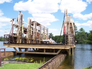 the car follows the rails into the upper lake, launching the boat