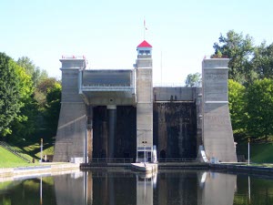 Built in 1904, the tall concrete structure lifts boats 65 feet, the highest hydraulic boat lifts in the world.