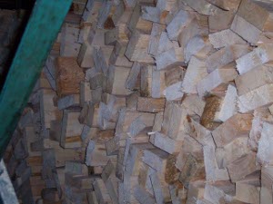 Hundreds of boards are piled in a bin waiting to be dried