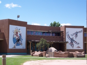 The front walls of the Pueblo Cultural Center in Albuquerque are decorated with two large murals
