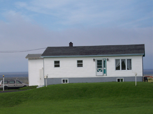 People already live in this outport home, although the front door opens
onto empty space