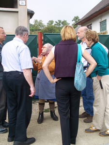 The mayor, translator, and party speak to a descendant of Juraj Jurus