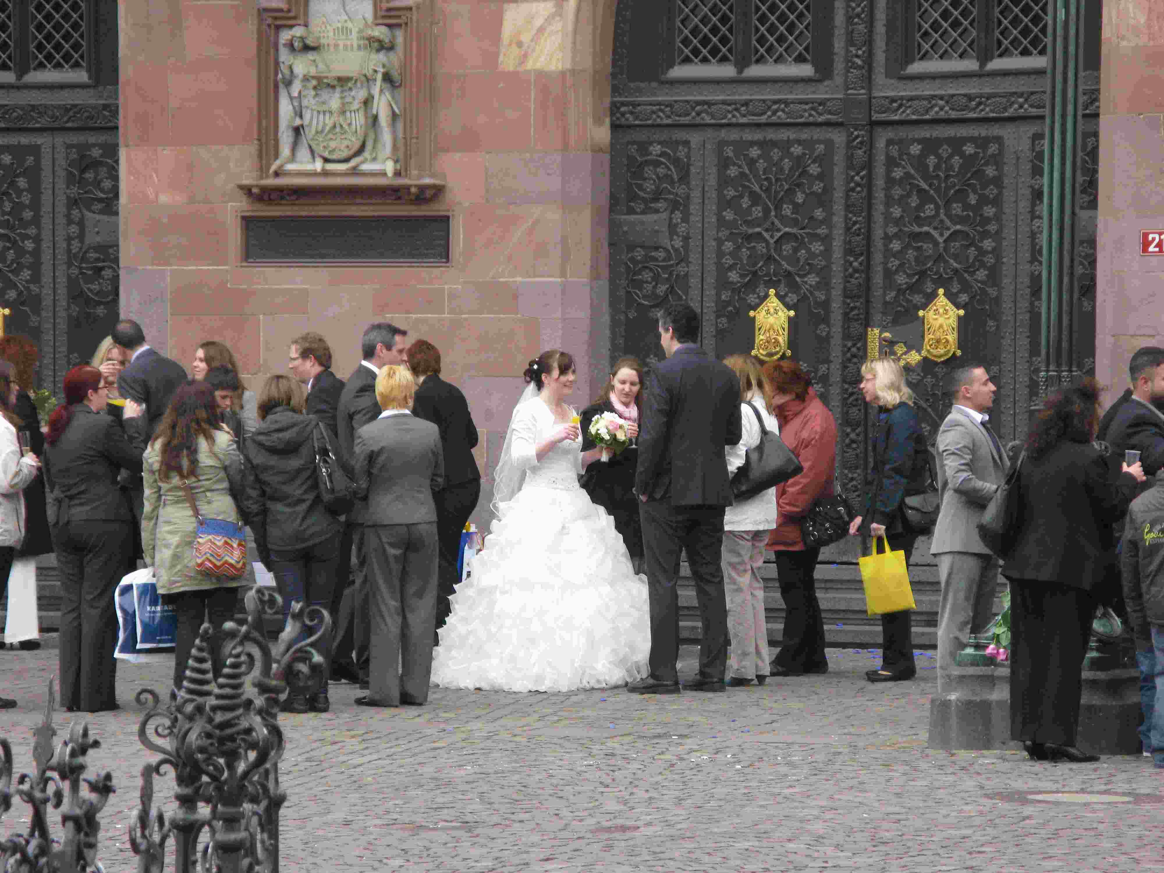 The wedding party celebrates on Romer Plaza