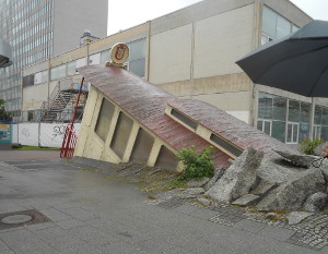 As public art, Frankfurt used a very old tram car to conceal the sidewalk entrance to the subway.  It looks as if the tram has crashed through the sidewalk!