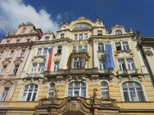 A beautiful yellow art nouveau building, four stories high