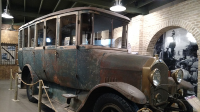 Made of heavy steel, the vehicle is some eight feet high, with six windows and three doors on each side.