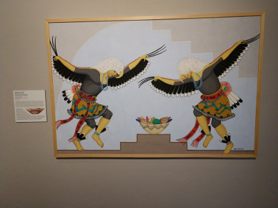 Done in great detail, this painting depicts two dancers dressed in eagle wing costumes.