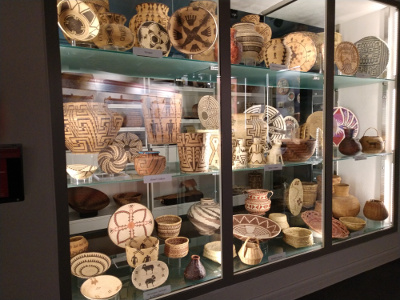 A large display case illustrates the variations in basketry styles from one tribe to another